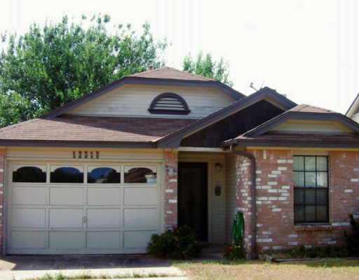 12310 Cedarspur Road Austin, TX 78758 - Photo 1 of 1 a front view of a house with garden