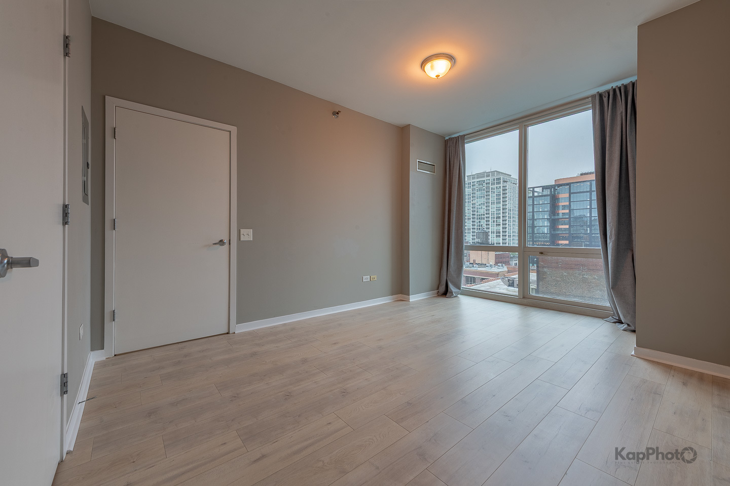 757 North Orleans Street, Unit 1104 Chicago, IL 60654 - Photo 11 of 30 wooden floor in an empty room with a window