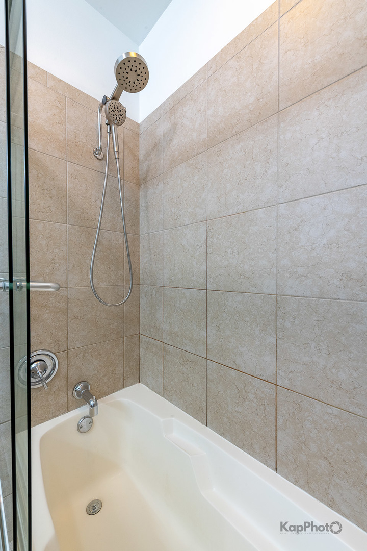 757 North Orleans Street, Unit 1104 Chicago, IL 60654 - Photo 16 of 30 a bathroom with a shower