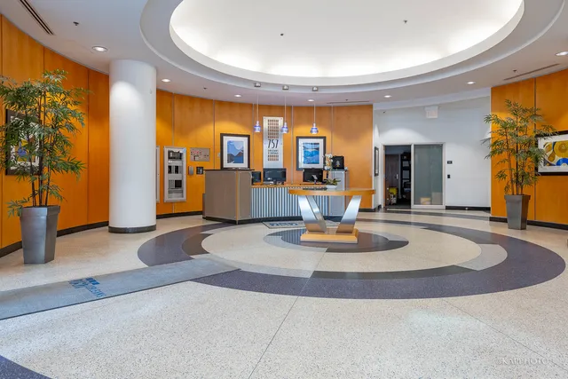 a view of kitchen with furniture and lamp