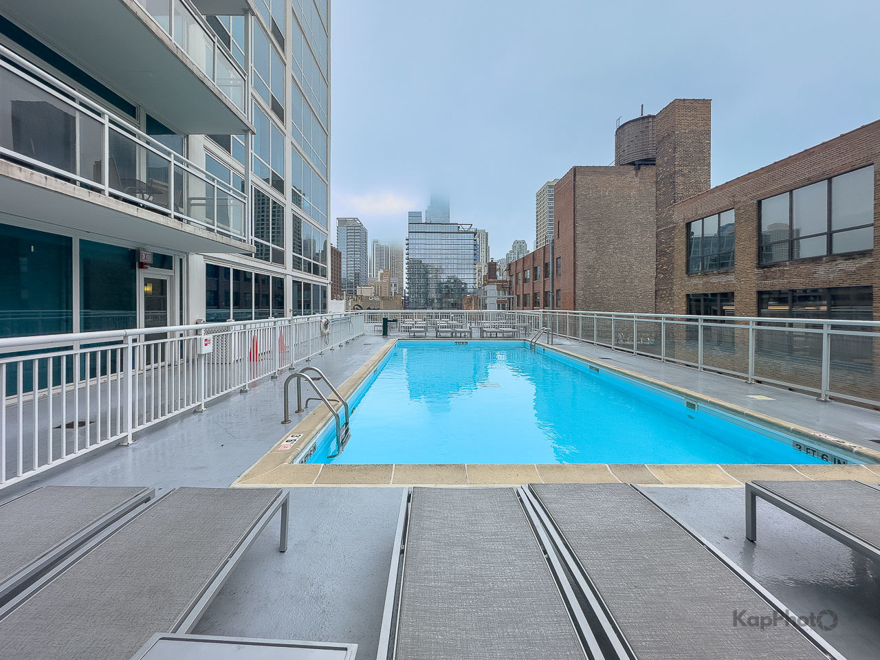 757 North Orleans Street, Unit 1104 Chicago, IL 60654 - Photo 28 of 30 a view of a swimming pool with a lounge chairs