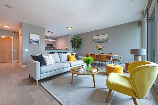 a living room with furniture and a lamp