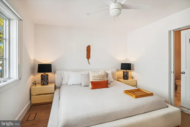 a living room with furniture and stairs