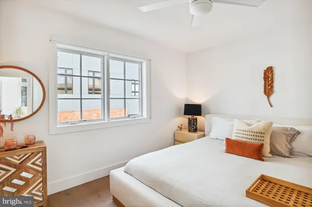 a bedroom with bed and window