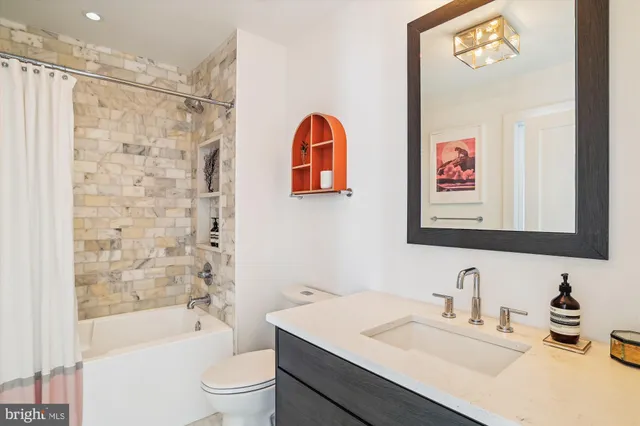 a bedroom with a bed and a walk in closet