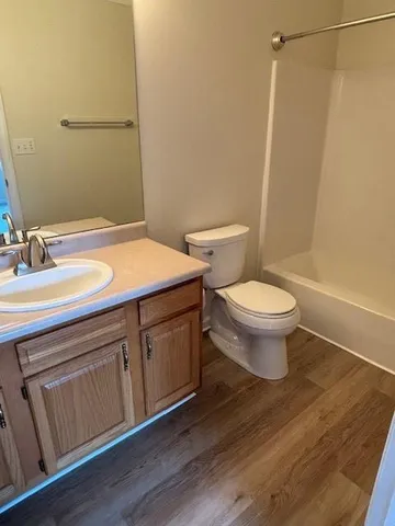 a bathroom with a sink toilet and vanity