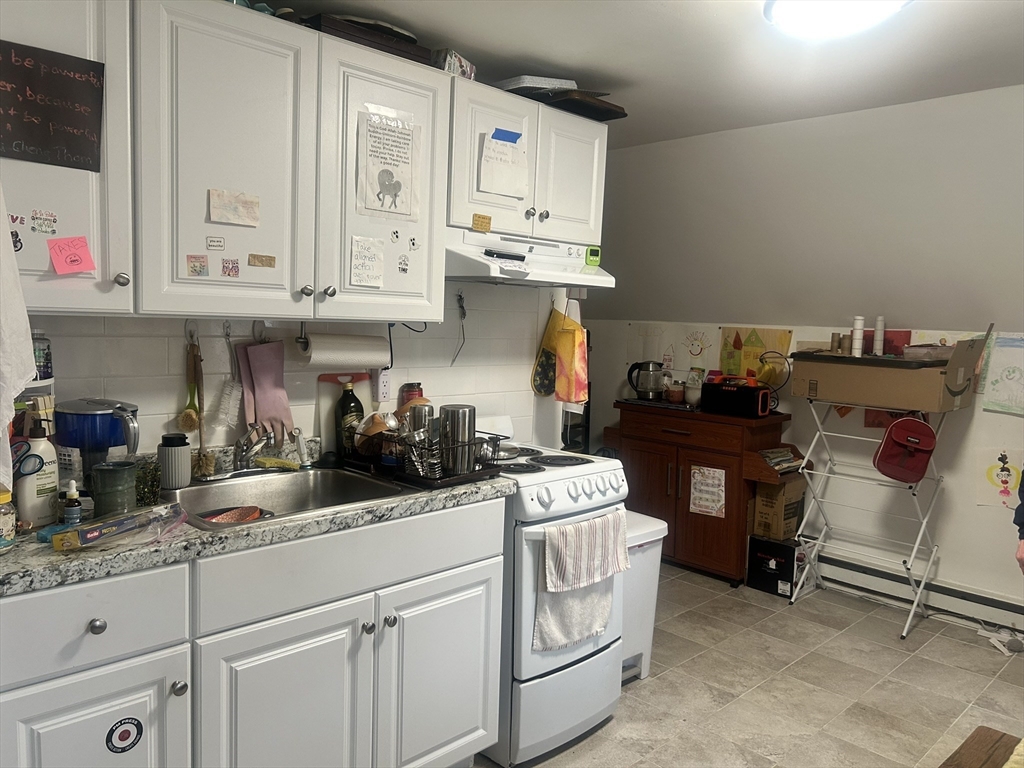 51 Acushnet Avenue Springfield, MA 01105 - Photo 11 of 22 a kitchen with stainless steel appliances granite countertop a sink and cabinets