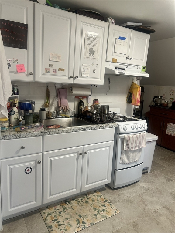 51 Acushnet Avenue Springfield, MA 01105 - Photo 12 of 22 a kitchen with stainless steel appliances granite countertop a sink and a stove