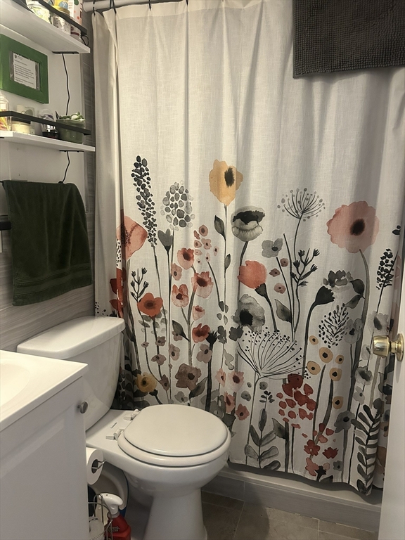 51 Acushnet Avenue Springfield, MA 01105 - Photo 13 of 22 a bathroom with a toilet sink and mirror