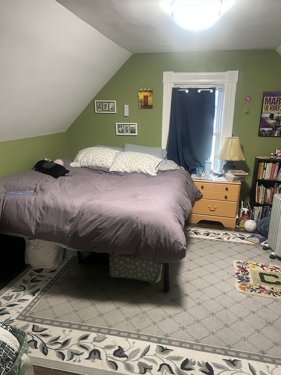 51 Acushnet Avenue Springfield, MA 01105 - Photo 8 of 22 a bedroom with a bed and a dresser