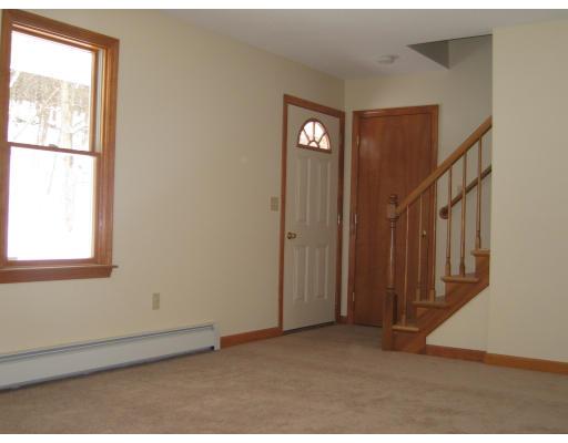 44 Bacon Road Ware, MA 01082 - Photo 3 of 9 a view of an empty room with windows
