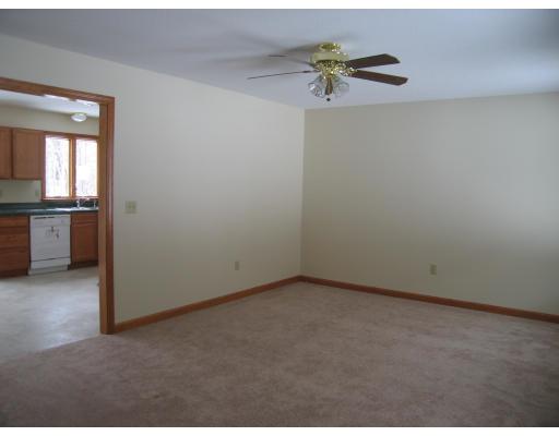 44 Bacon Road Ware, MA 01082 - Photo 4 of 9 an empty room with a window and a ceiling fan