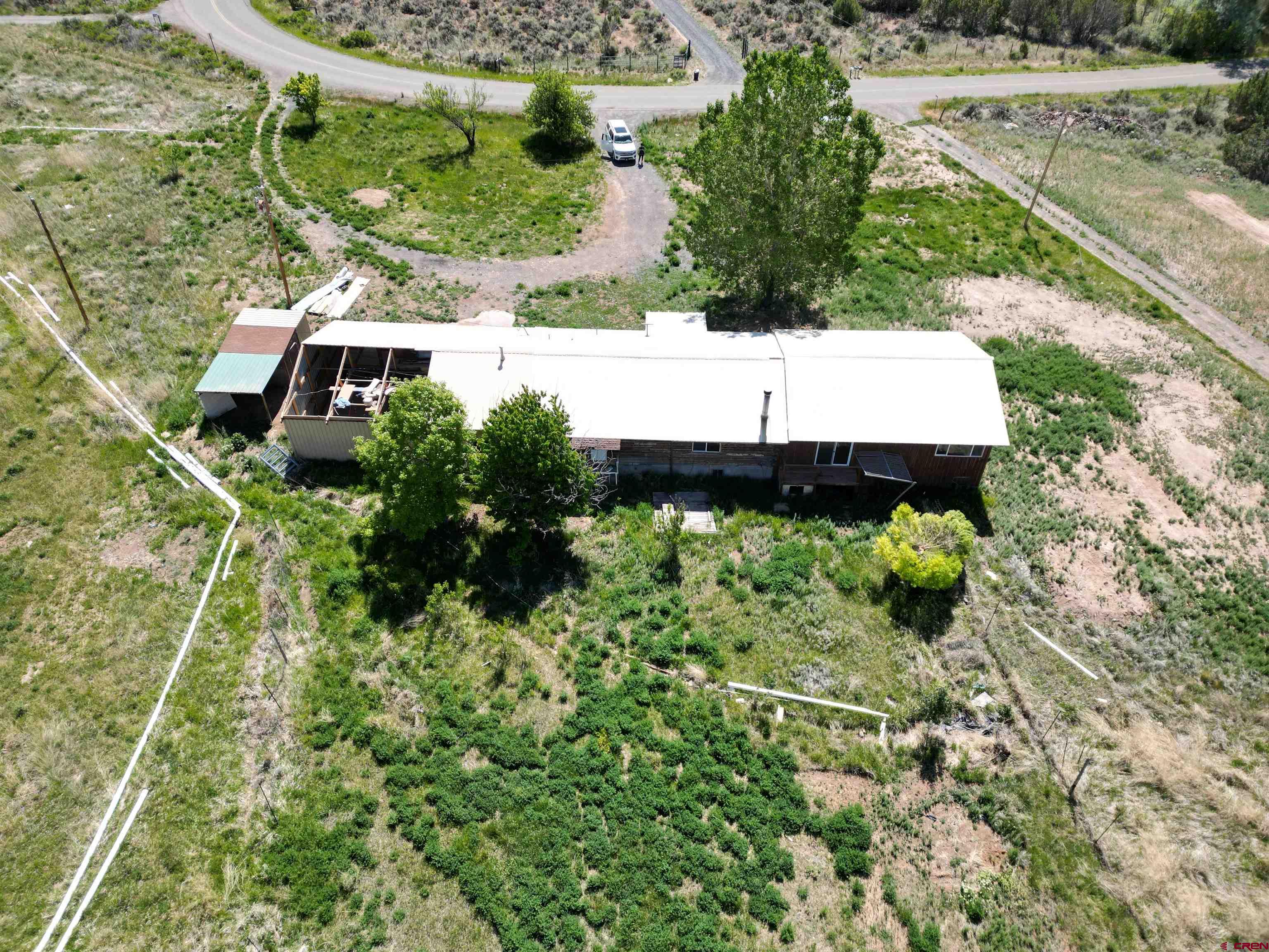 26563 Redlands Mesa Road Hotchkiss, CO 81419 - Photo 3 of 14 a view of a garden with a pathway