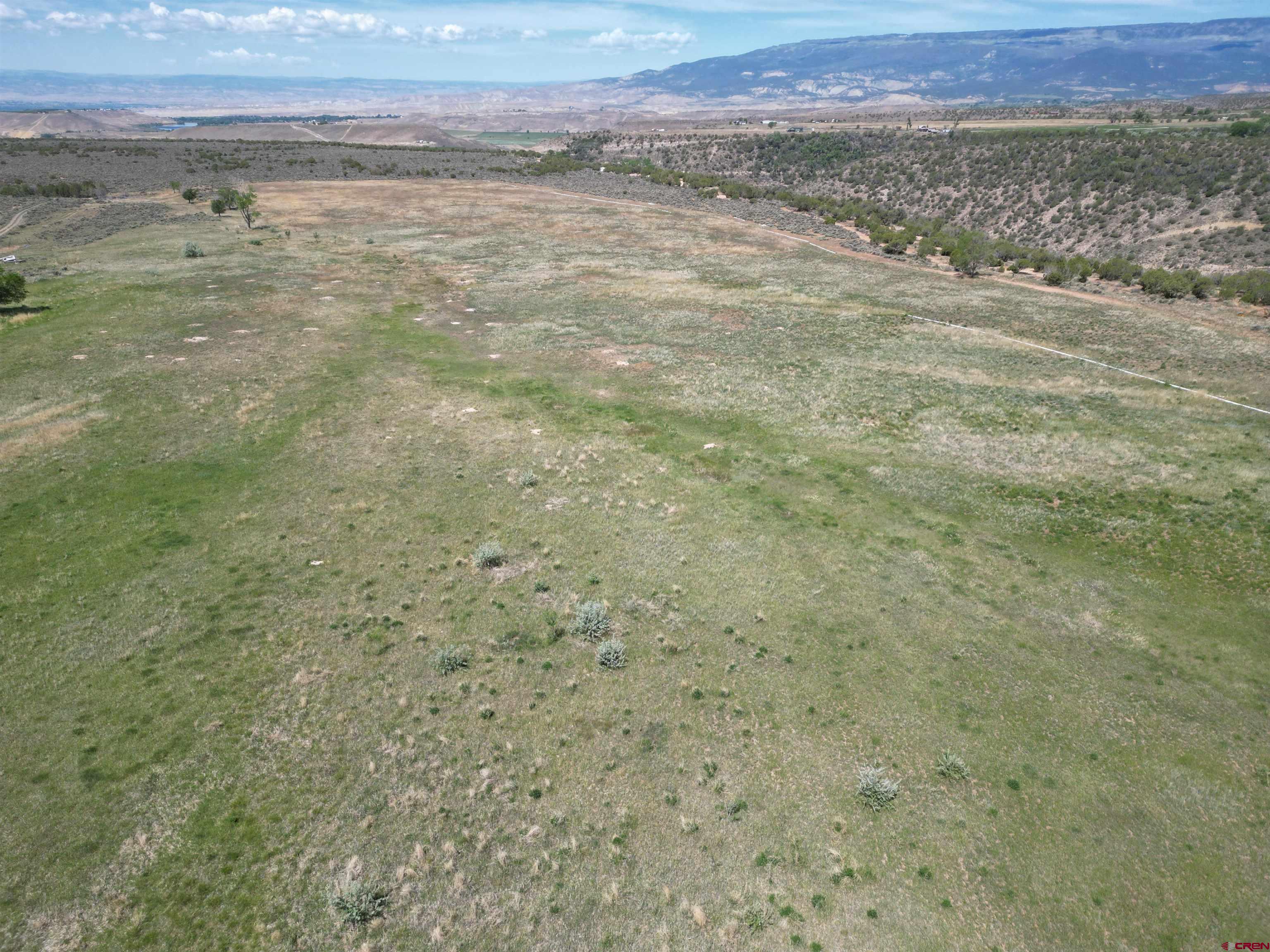 26563 Redlands Mesa Road Hotchkiss, CO 81419 - Photo 4 of 14 a view of an outdoor space and mountain view