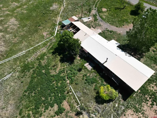 an aerial view of residential house with outdoor space