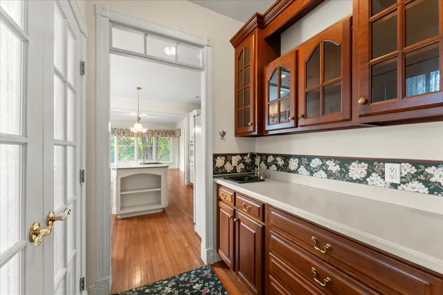 a kitchen with stainless steel appliances granite countertop a stove and a sink