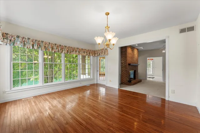 a view of livingroom with furniture fire place and window