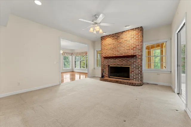 a kitchen with a refrigerator and a stove top oven