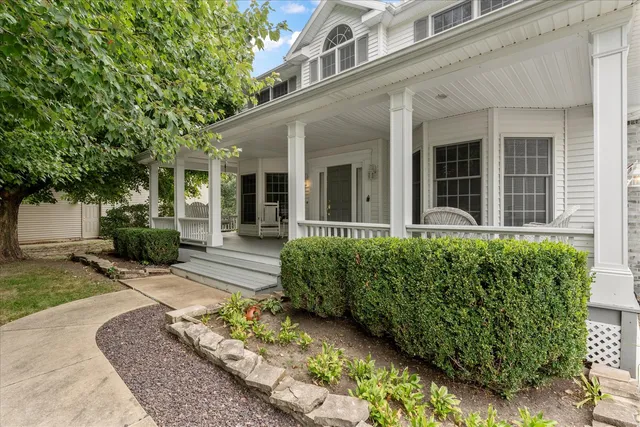 a view of a balcony with chair and table