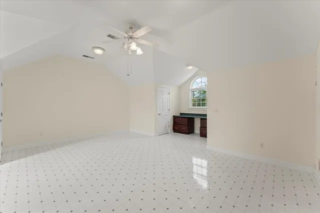 a bathroom with a white shower and a sink
