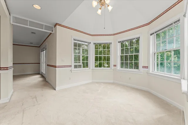 a view of a livingroom with an empty space and a fireplace