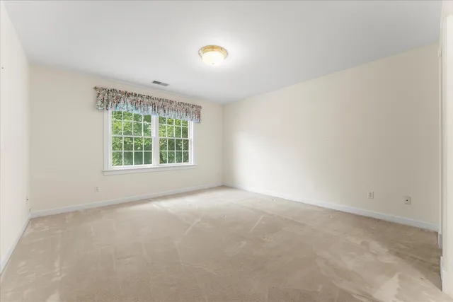 a view of a building with a yard