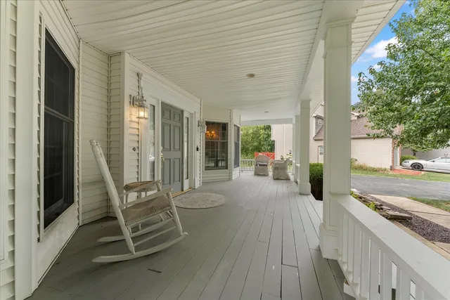 a living room with wooden floor and furniture