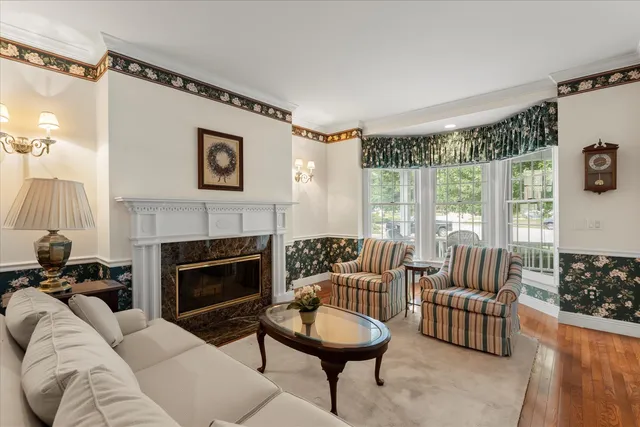 a view of a dining room with furniture and chandelier