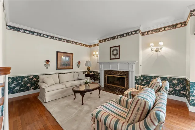 a view of a dining room with furniture and chandelier