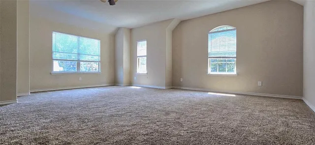 an empty room that has a window