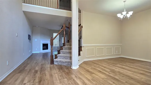a view of entryway with wooden floor and stairs