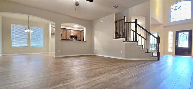 a view of an entryway with wooden floor
