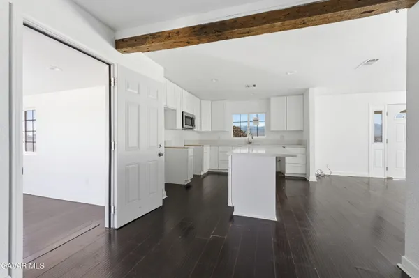 a kitchen with a refrigerator and a sink