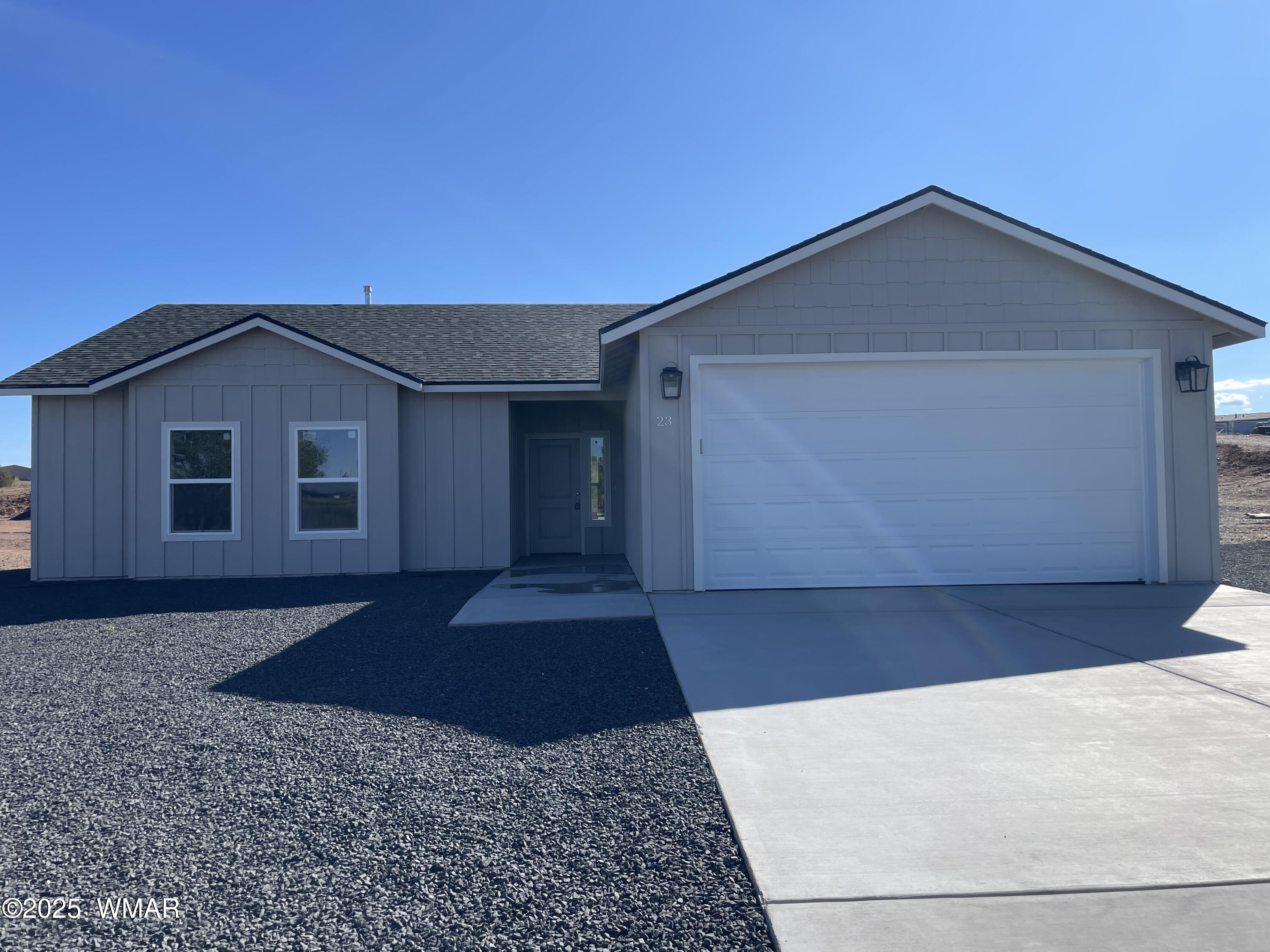 23 South Foothills Boulevard Taylor, AZ 85939 - Photo 1 of 16 a front view of a house with a yard