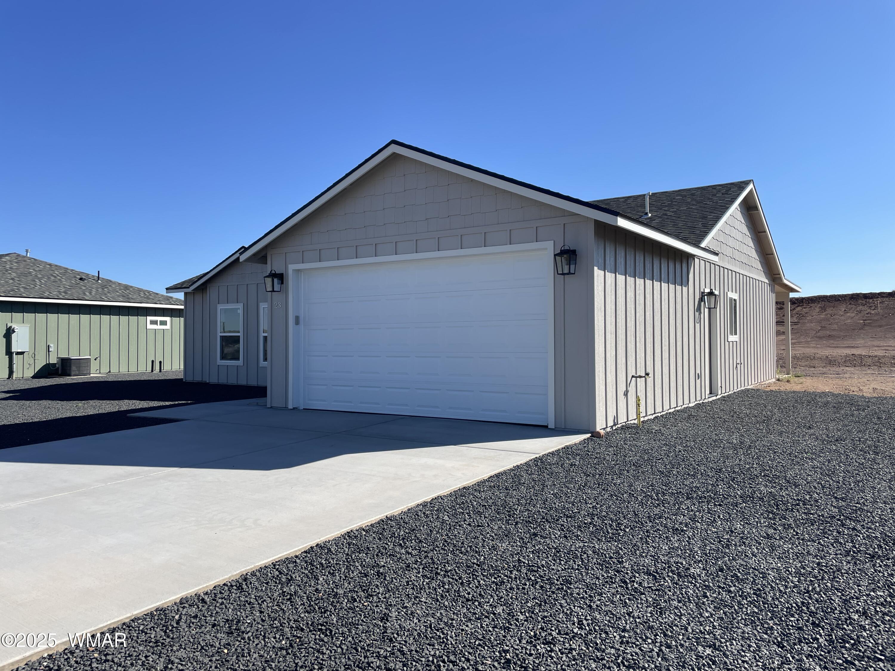 23 South Foothills Boulevard Taylor, AZ 85939 - Photo 2 of 16 a front view of a house with a yard