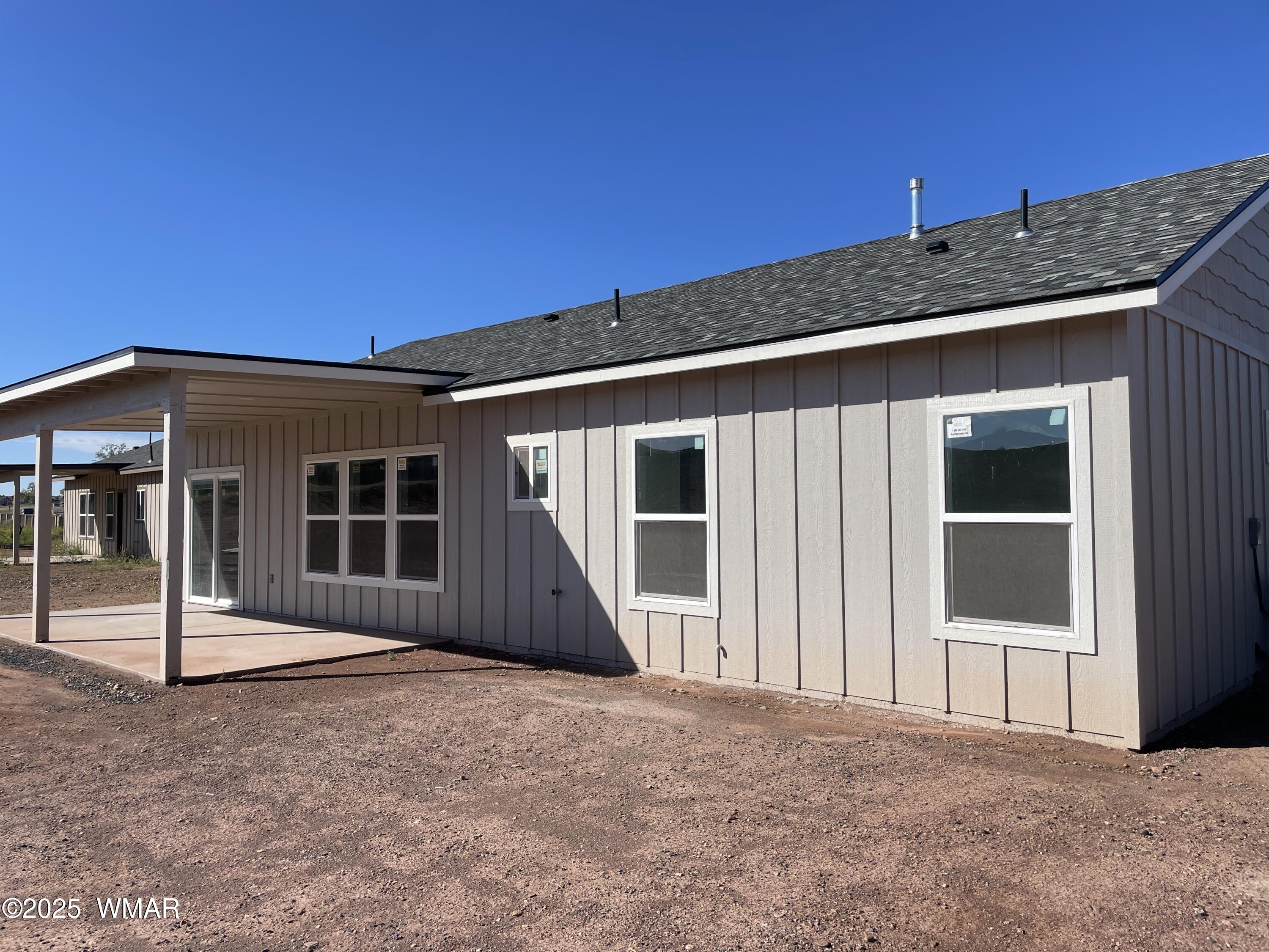 23 South Foothills Boulevard Taylor, AZ 85939 - Photo 4 of 16 a front view of a house with a porch