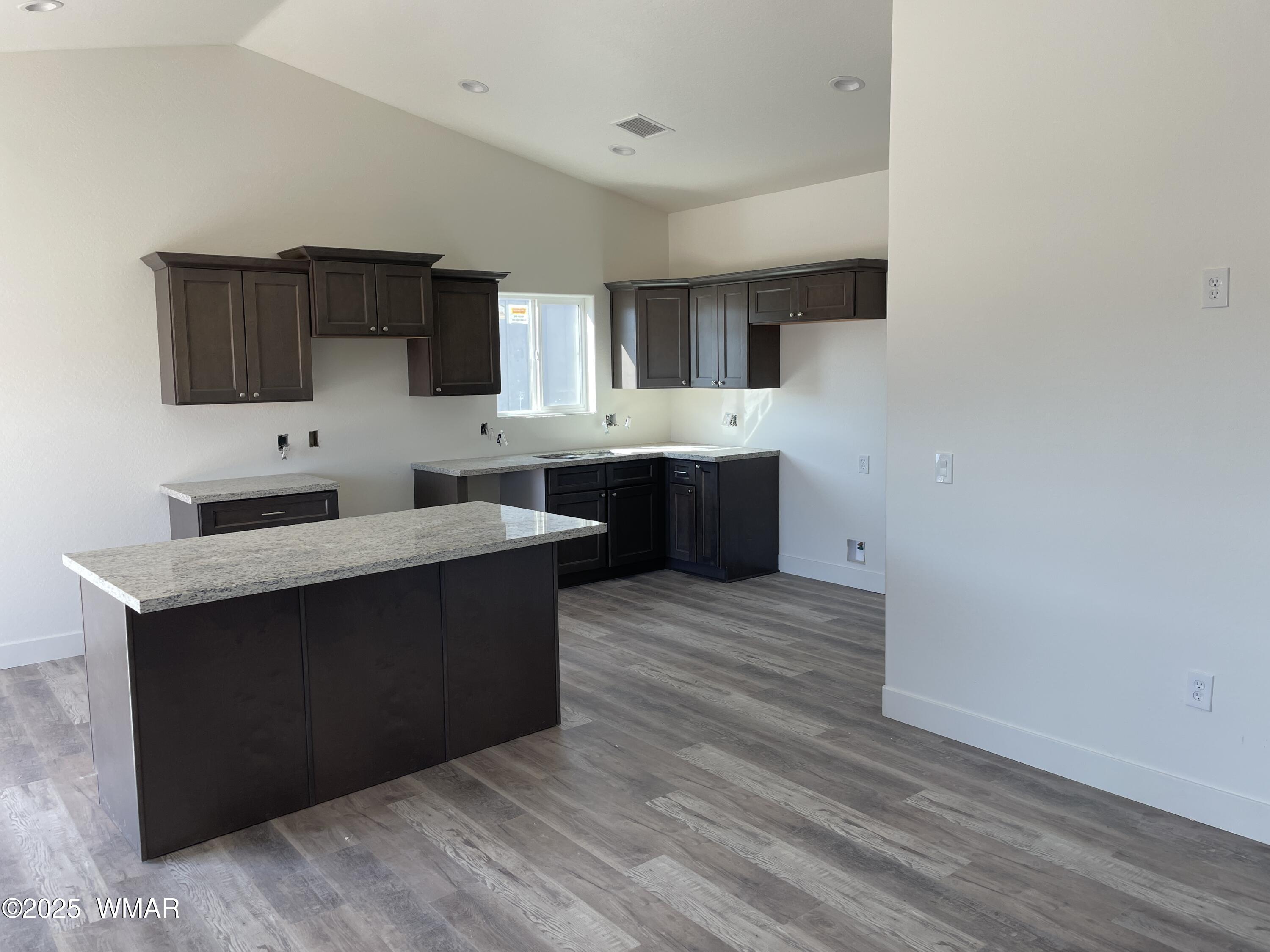 23 South Foothills Boulevard Taylor, AZ 85939 - Photo 6 of 16 a kitchen with stainless steel appliances a sink stove and cabinets