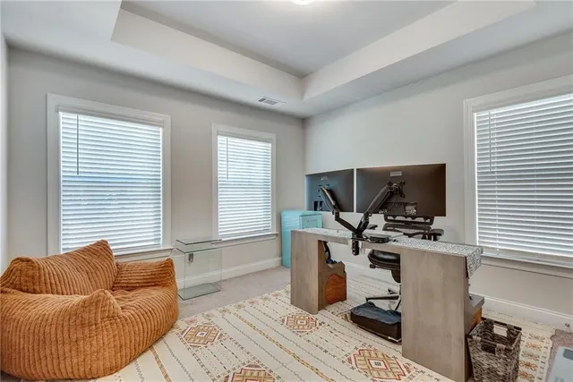 a workspace with furniture and a flat screen tv