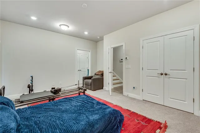 a bedroom with furniture and a window