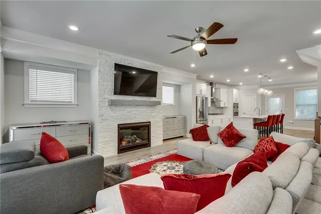 a living room with furniture fireplace and a flat screen tv