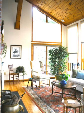 55 Buffam Road Pelham, MA 01002 - Photo 8 of 30 a living room with furniture and a large window