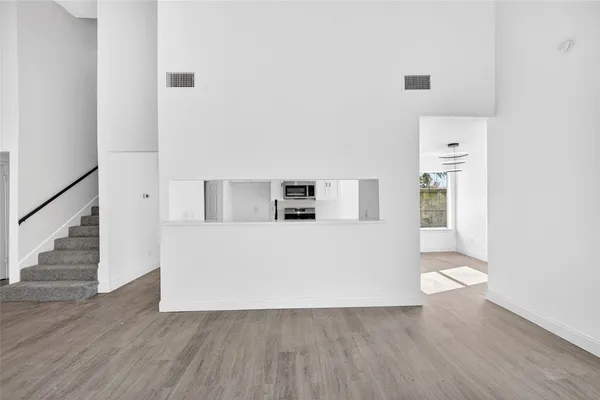 a view of kitchen and wooden floor