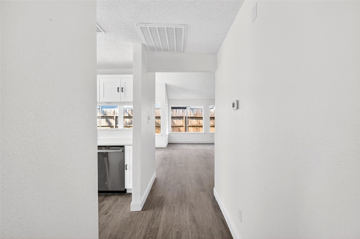 24007 Landing Way Drive Spring, TX 77373 - Photo 14 of 44 a view of a kitchen from the hallway with a window
