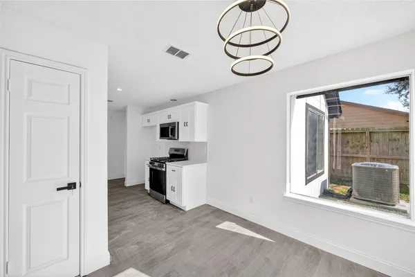 a view of a kitchen and a window