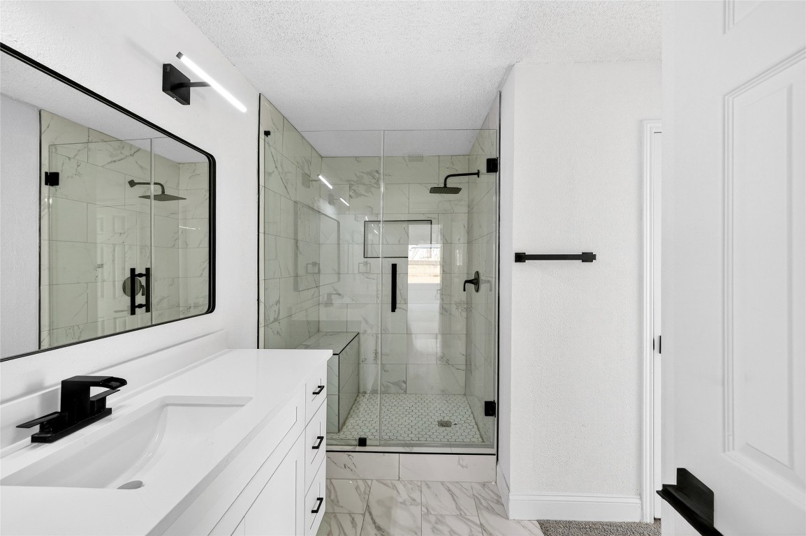 24007 Landing Way Drive Spring, TX 77373 - Photo 31 of 44 a bathroom with a sink a shower and a mirror