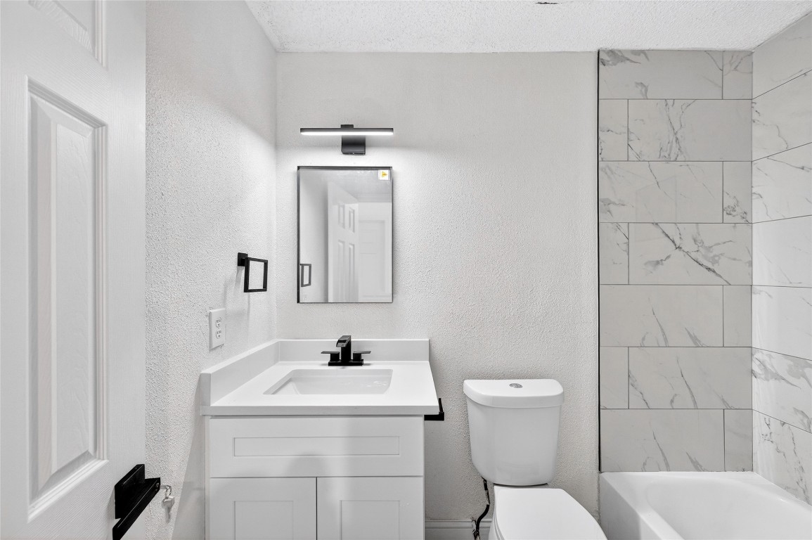 24007 Landing Way Drive Spring, TX 77373 - Photo 37 of 44 a bathroom with a toilet sink and mirror