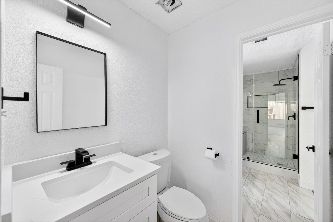 24007 Landing Way Drive Spring, TX 77373 - Photo 39 of 44 a bathroom with a sink a toilet and shower