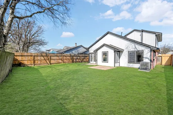 a backyard of a house with lots of green space
