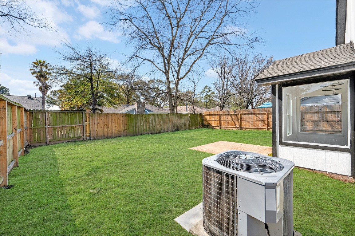 24007 Landing Way Drive Spring, TX 77373 - Photo 44 of 44 a backyard of a house with lots of green space