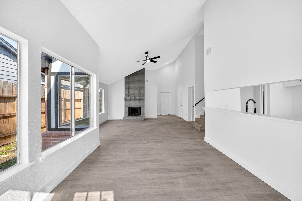 24007 Landing Way Drive Spring, TX 77373 - Photo 6 of 44 a view of an empty room with a fireplace and a window